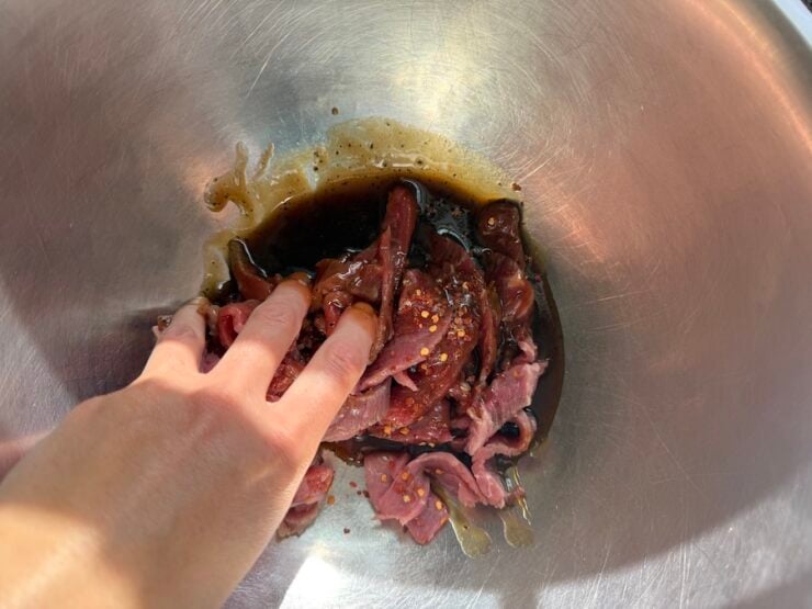 image of thinly sliced beef tossed in a stir-fry sauce for beef and broccoli