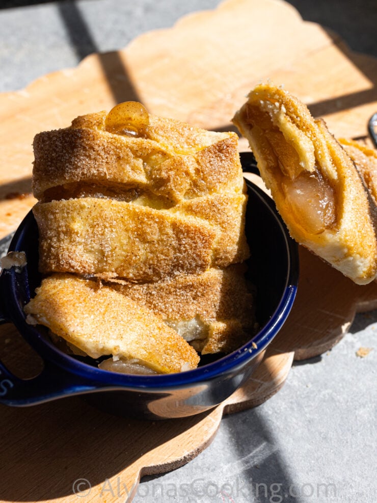 image of sliced braided apple hand pies in a mini Staub dish