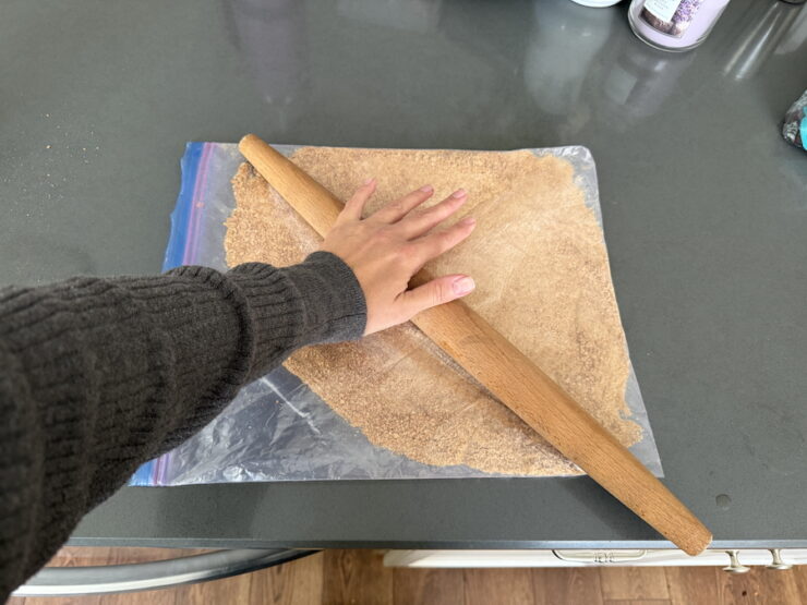 image of graham crackers being crushed for S'mores tarts