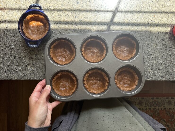 image of homemade tarts pressed into a muffin pan to make S'more tarts