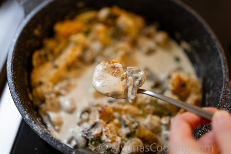 image of smothered chicken in a rich whole mushroom gravy