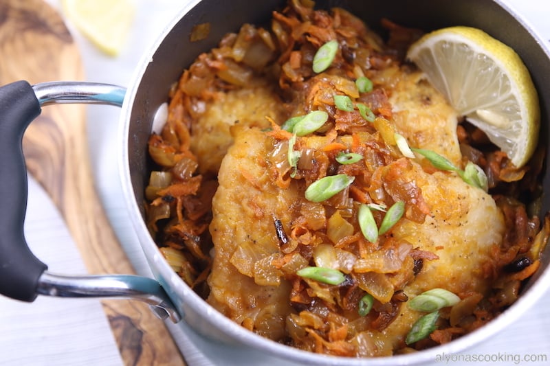 Close-up view of perfectly simmered breaded Swai fillets, showcasing their creamy texture.