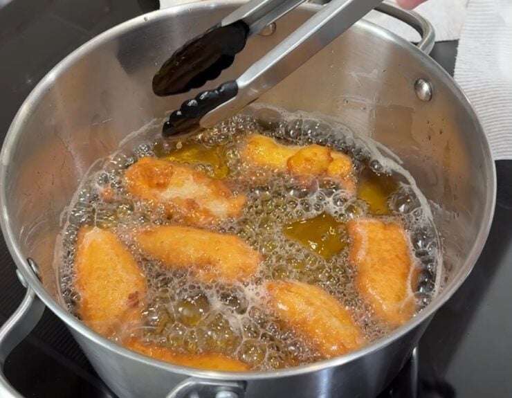 golden brown, light, and airy Chinese chicken fingers floating in oil