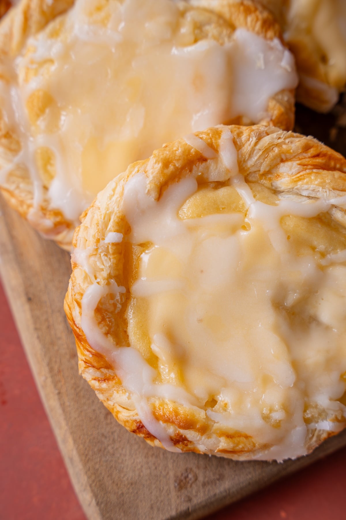 Zoomed in cream cheese Danish with powdered sugar glaze