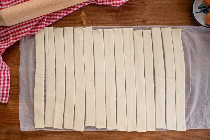 puff pastry dough cut into strips for forming "nests"