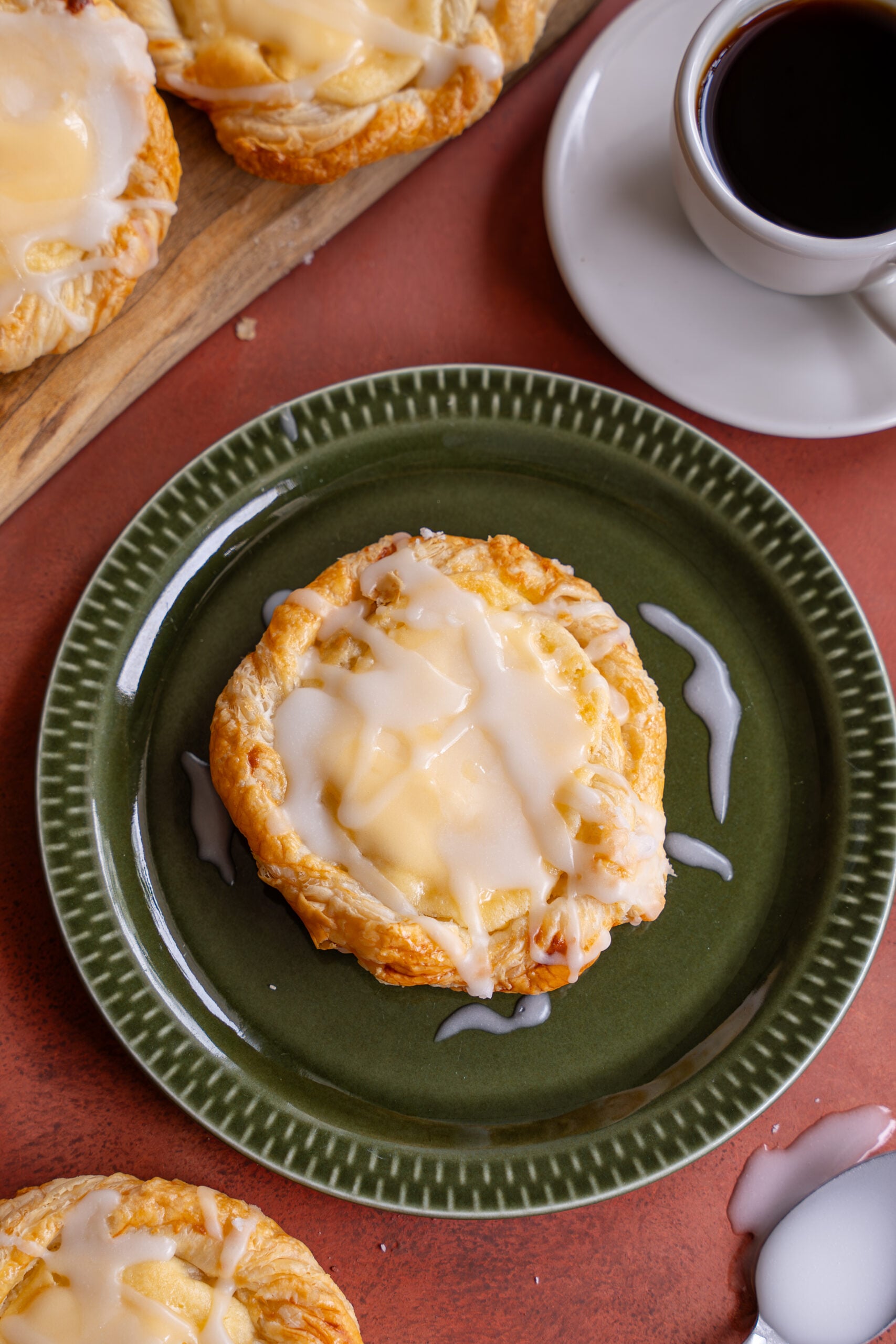 easy cheese danish made with flaky puff pastry on a green plate