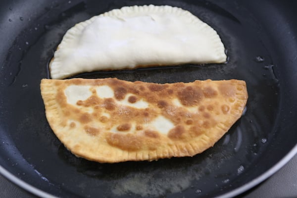 Frying Chebureki in a Skillet