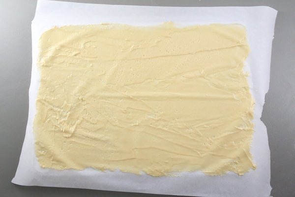 thin honey cake batter spread over a sheet pan