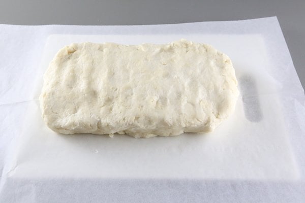 Rugelach dough formed into a rectangle to chill