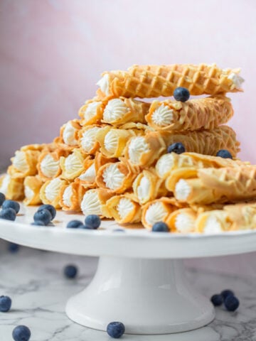 rolled pizzelle with cream that were made with a pizzelle maker called trubochki in Russian