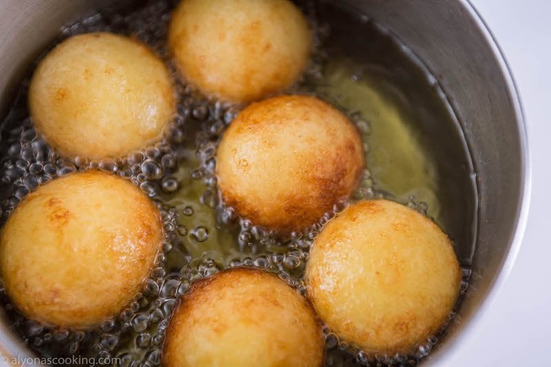 frying donut holes (Ponchiki)