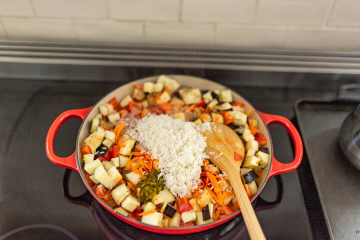 all of the eggplant ingredients in a pan to sauté and simmer