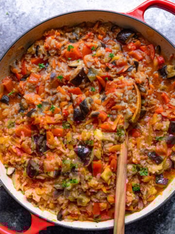 chunky fried eggplant recipe with tomatoes and vegetables in a pan