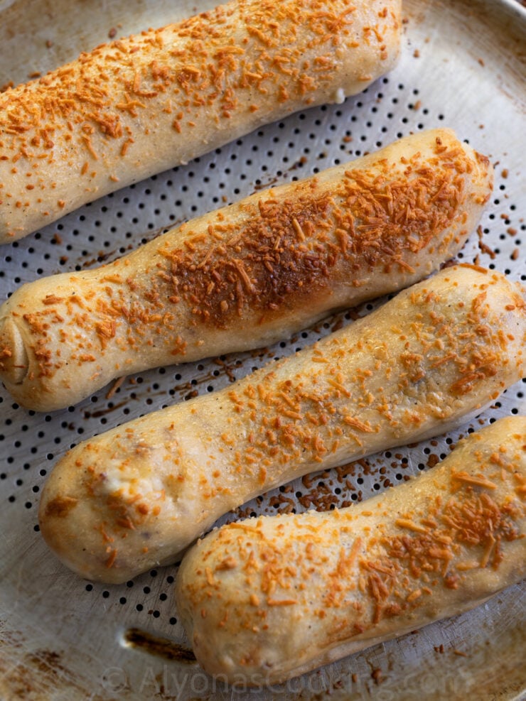 image of crispy and crunchy Costco chicken bakes baked on a perforated pizza pan 