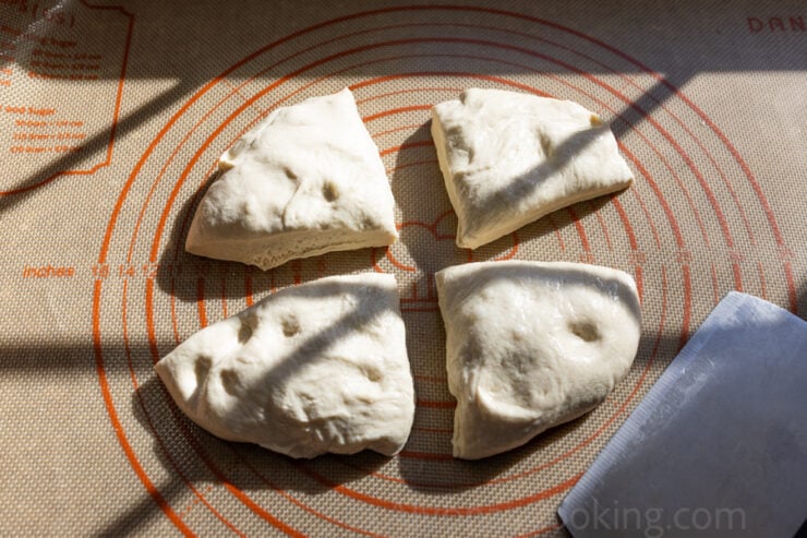 image of homemade Costco pizza dough divide into fours 