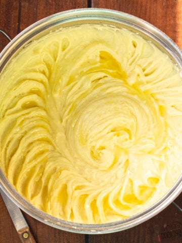 how to make the best mashed potatoes recipe by mashing boiled potatoes in a pot