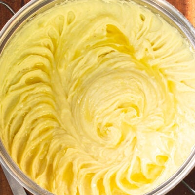 how to make the best mashed potatoes recipe by mashing boiled potatoes in a pot