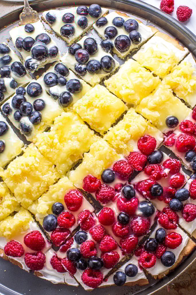 easy-fruit-pizza - A colorful fruit pizza sliced and ready to serve.