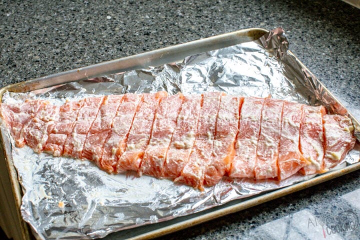 how to cook salmon in oven. Place 3-pound salmon fillet on a foil-lined baking sheet and slice into 1-inch pieces.