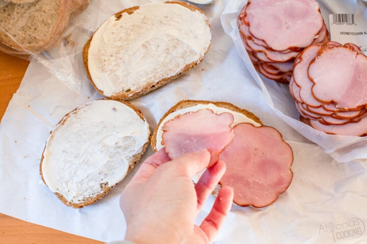 Russian tea sandwiches being assembled with honeycomb ham and bread