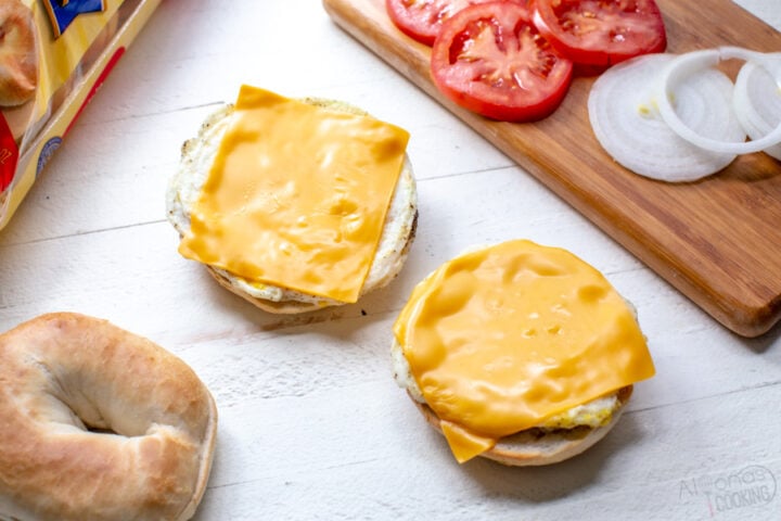 eggs with American cheese on plain bagels for breakfast sandwiches