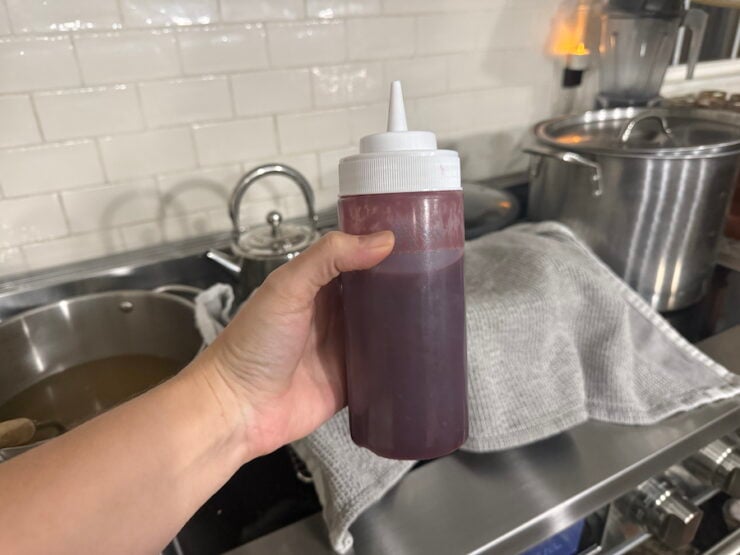 image of homemade raspberry sauce for a raspberry swirl cheesecake