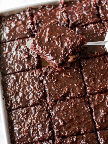 tender chocolate sheet cake slice with a coconut fudge frosting