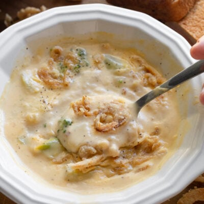 broccoli cheese soup in a soup bowl with spoon