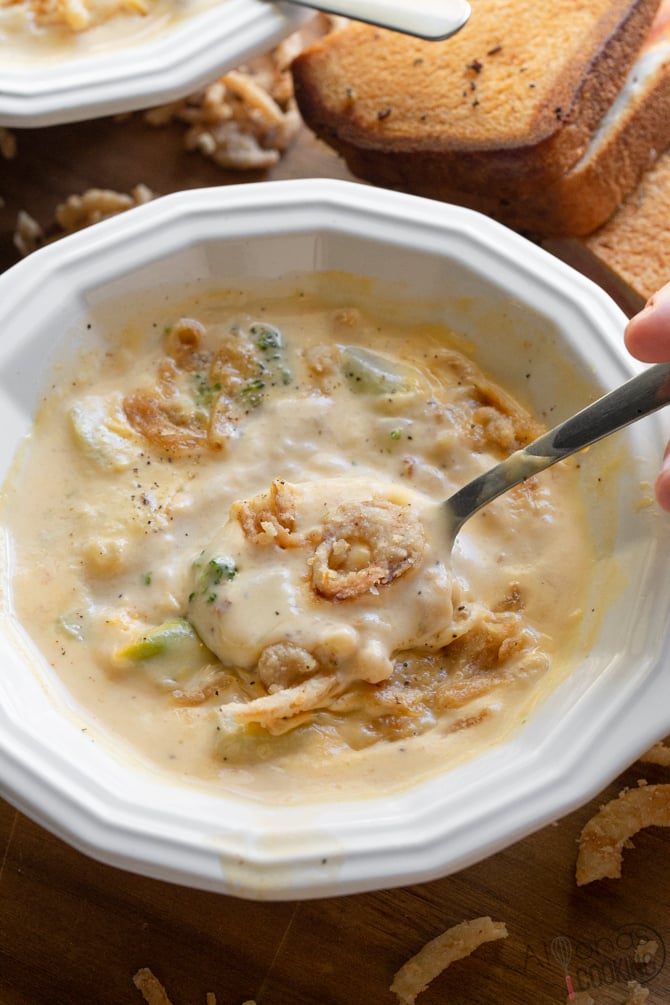 broccoli cheese soup in a soup bowl with spoon