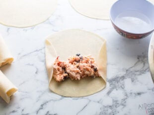 Southwestern egg roll ingredients in a flour tortilla