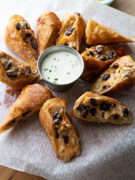 southwestern egg rolls recipe cut and served with ranch