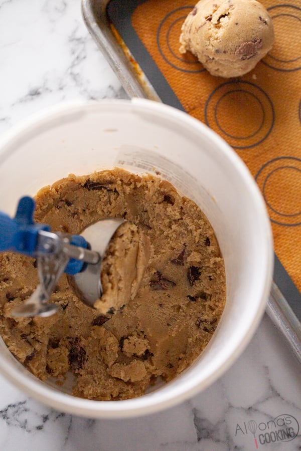the secret to bakery style chocolate chip cookies is to refrigerate or chill cookie dough batter then scoop with a 2oz cookie scoop