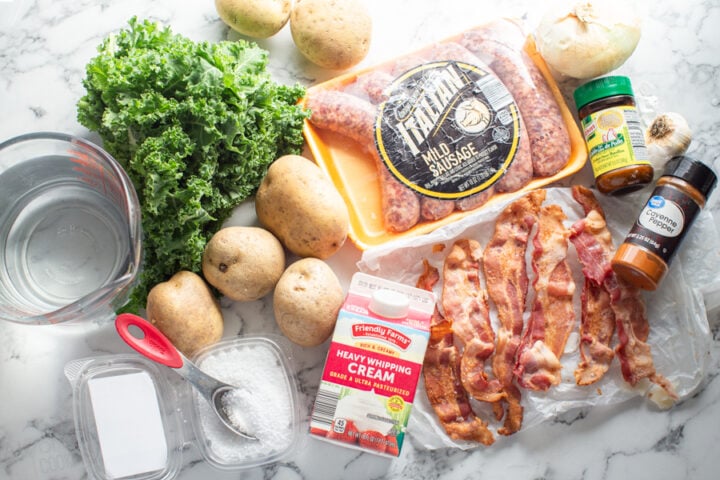 ingredients for Zuppa Toscana: potatoes, bacon, heavy cream, cayenne pepper, chicken bouillon, salt, water, fresh kale, onion, Italian pork sausage, and garlic