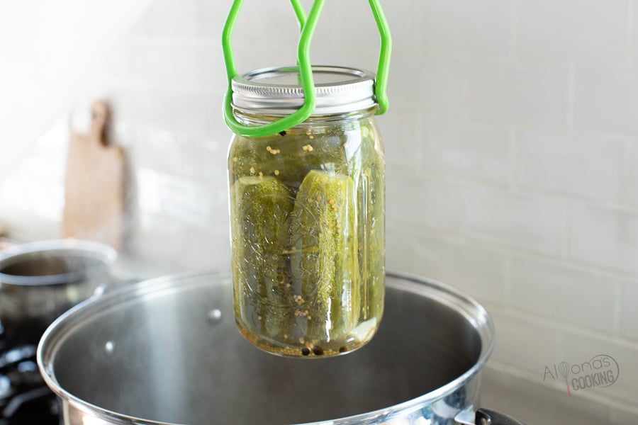canned pickles removed from a water bath 
