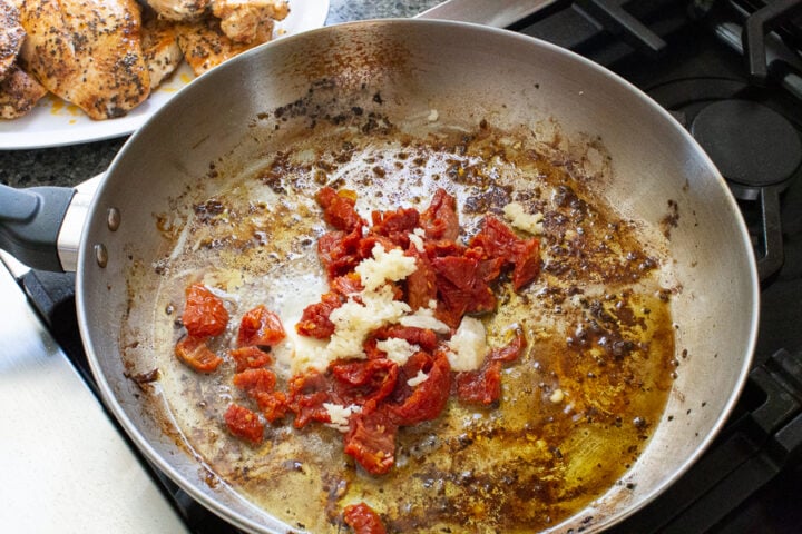 image of sun-dried tomatoes in a skillet for Tuscan chicken