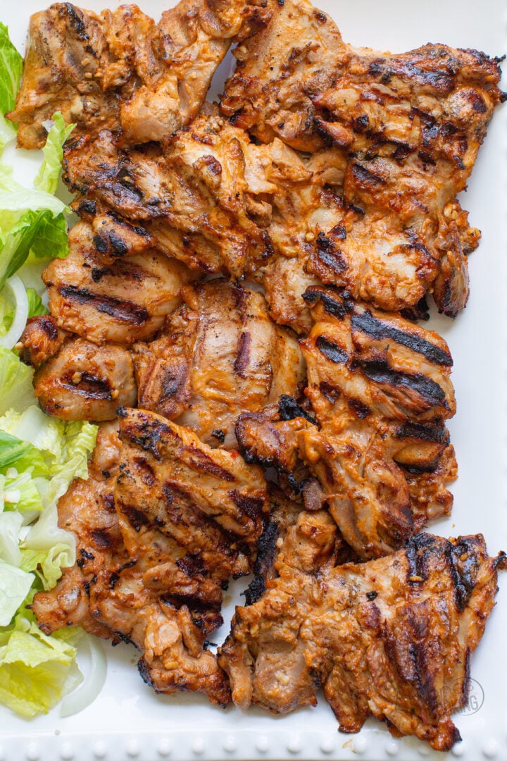 grilled chicken thighs on a platter