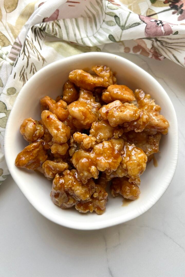 over head view of homemade Panda Express Orange Chicken in a white bowl
