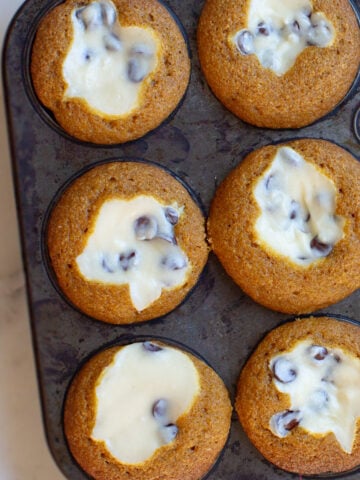 pumpkin cream cheese muffins with cheesecake filling and chocolate chips
