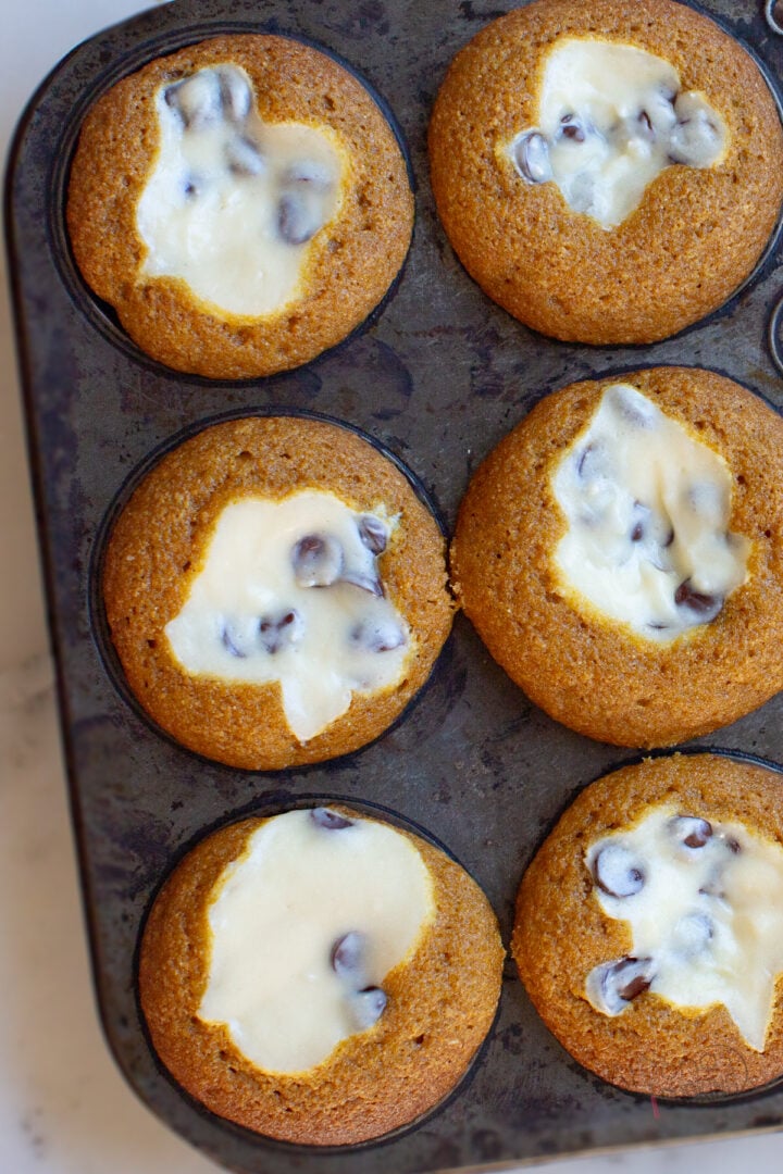 pumpkin cream cheese muffins with cheesecake filling and chocolate chips