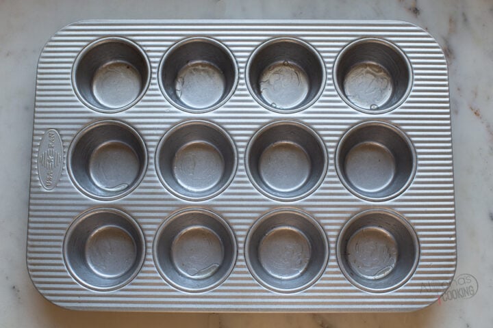 prepared muffin pan for egg bites