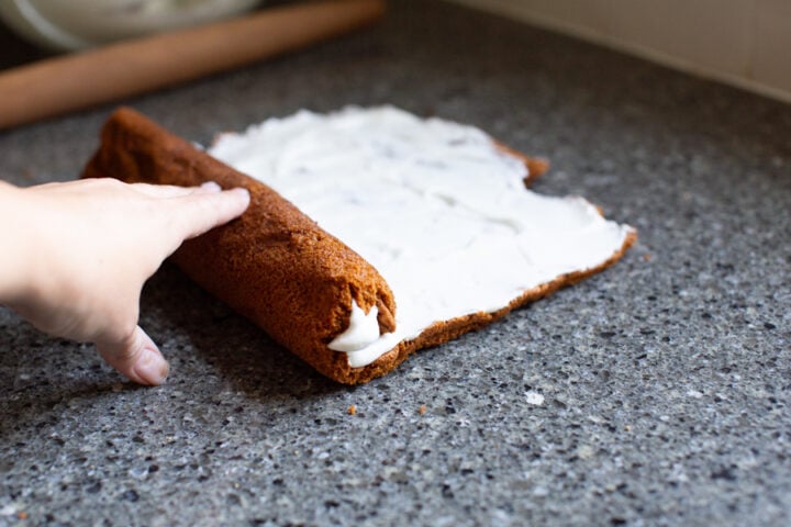 filling and rolling up honey cake roll