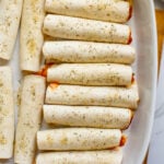 pizza roll ups in a baking dish