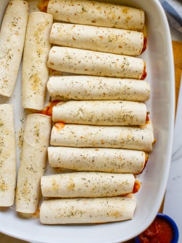 pizza roll ups in a baking dish