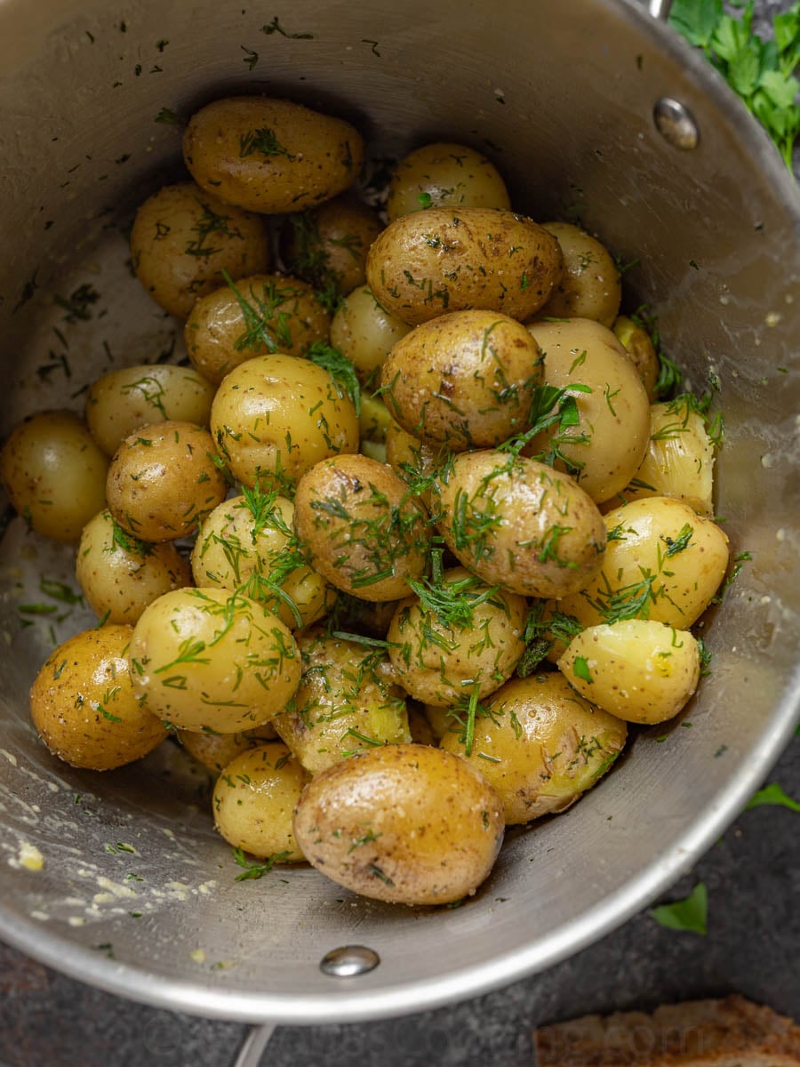 image of whole baby boiled potatoes tossed in butter and dill