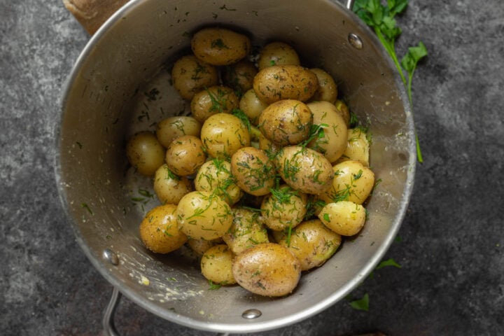 boiled potatoes garnished with dill and parsley