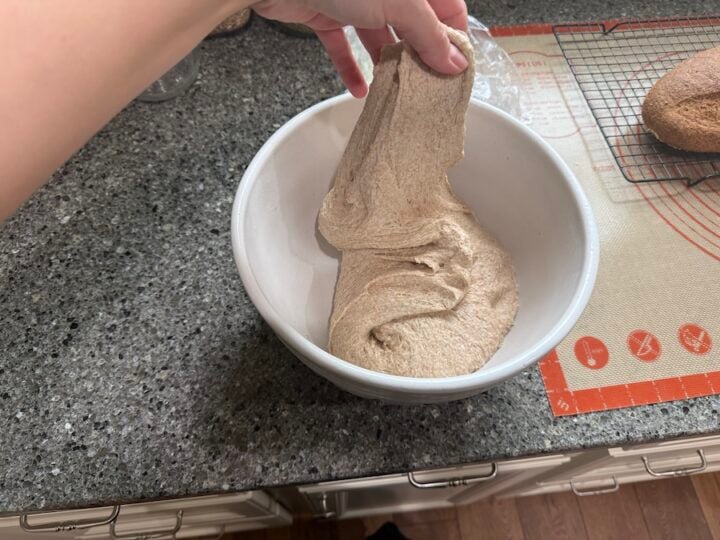 performing stretch and folds for baguette dough