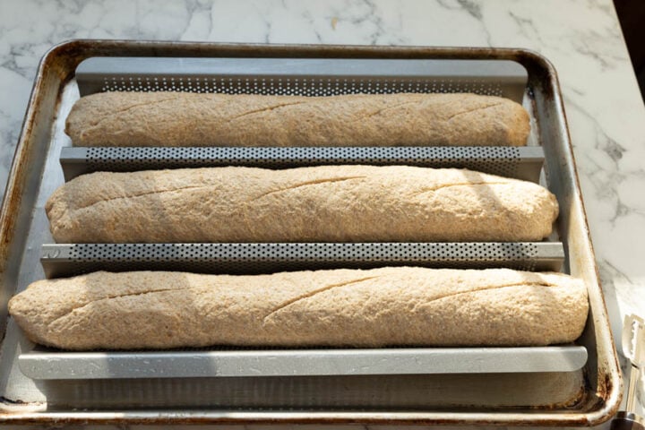scoring the baguette dough