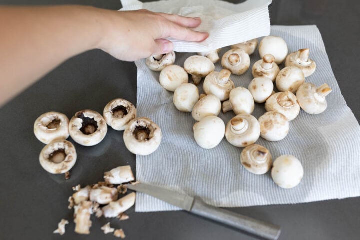 cleaning whole white mushrooms for Longhorn stuffed mushrooms