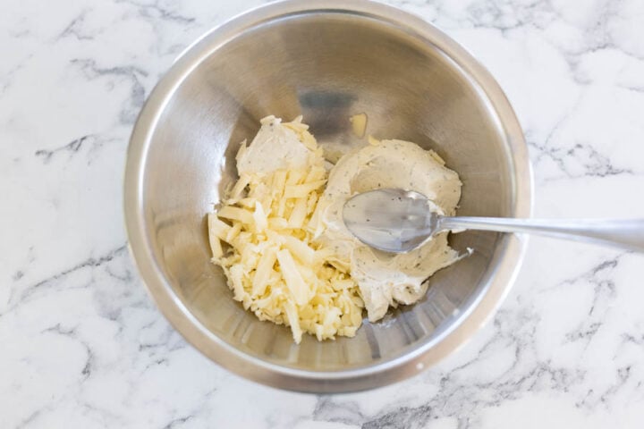Making the garlic herb cream cheese filling for longhorn stuffed mushrooms
