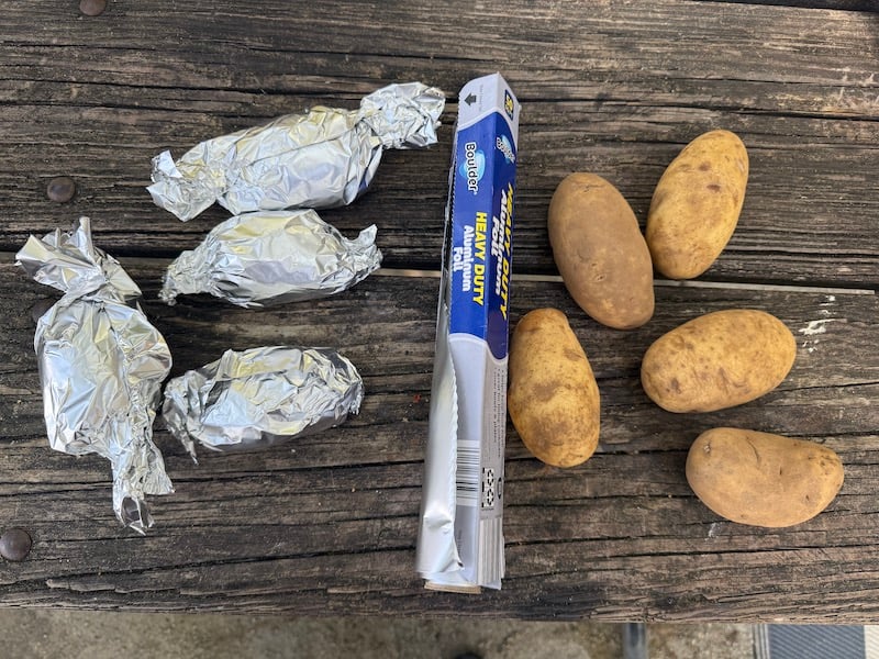 image of ingredients and equipment for campfire baked potatoes